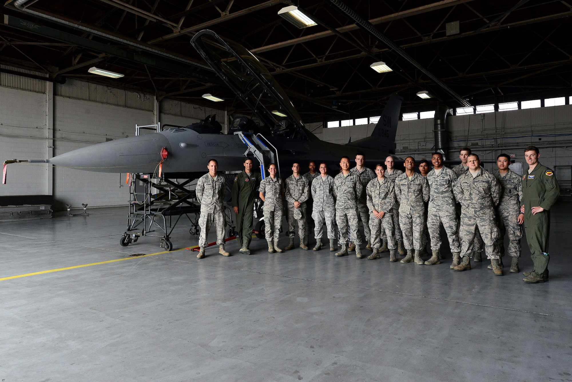 Airmen from the 20th Fighter Wing gather for a group photo during the Operations Immersion Program at Shaw Air Force Base, S.C., June 9, 2015. Some things the Airmen learned during the program is the requirements a fully qualified F-16 pilot needs to accomplish for training, descriptions of the various missions the pilots train for, what a typical training sortie is like, and some descriptions of the systems and tactics. (U.S. Air Force photo by Senior Airman Diana M. Cossaboom/Released)