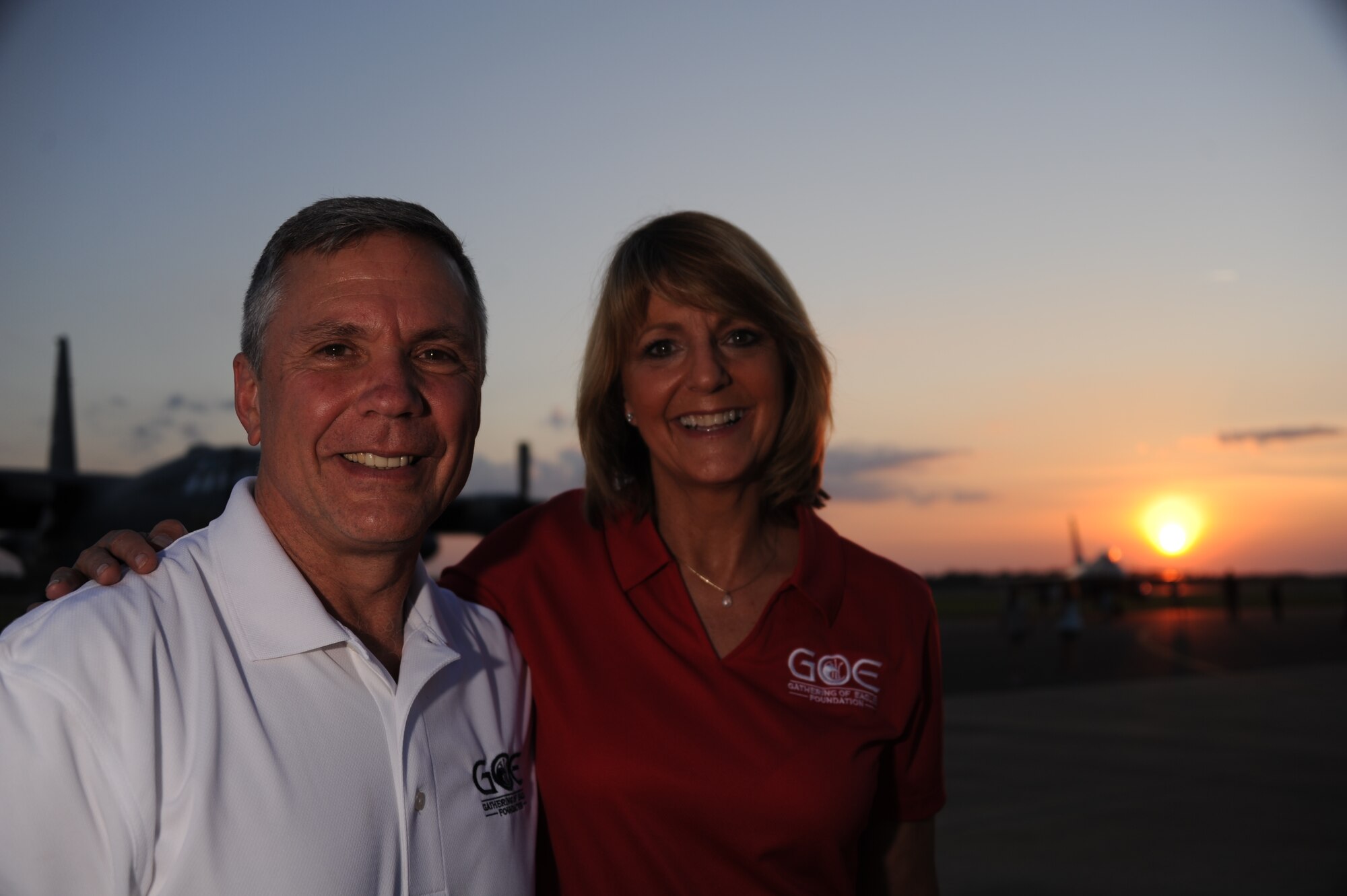 Retired Air Force Maj. Gen. Margaret Woodward, 2015 Gathering of the Eagles honoree, and her husband retired Air Force Brig. Gen. Daniel Woodward stop for a photo on the flight line during the GOE and Air Command and Staff College barbeque, June 5, 2015, Maxwell Air Force Base, Alabama. Started in 1980, GOE is an annual event hosted by ACSC to honor men and women who have made significant contributions to air, space and cyberspace power. (U.S. Air Force photo by Airman 1st Class Alexa Culbert) 
