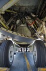 Airmen from the 5th Aircraft Maintenance Squadron perform maintenance underneath a B-52H Stratofortress at Minot Air Force Base, N.D., June 11, 2015. The B-52H can perform strategic attack, close-air support, air interdiction, offensive counter-air and maritime operations. (U.S. Air Force photo/Airman 1st Class Justin T. Armstrong)