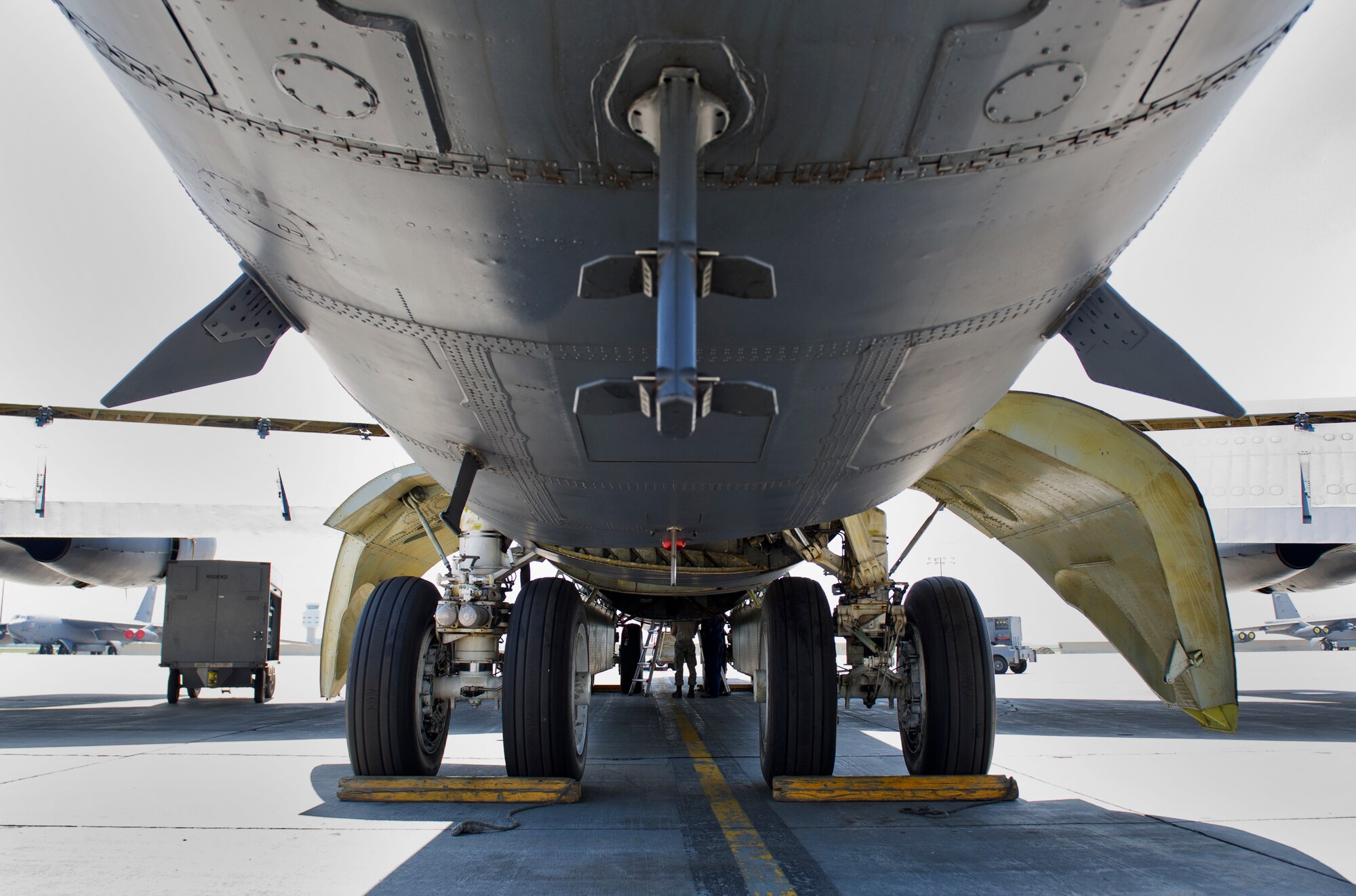 Airmen from 5th Aircraft Maintenance Squadron perform routine maintenance underneath a B-52H Stratofortress at Minot Air Force Base, N.D., June 11, 2015.   The bomber is capable of flying at high subsonic speeds at altitudes up to 50,000 feet. (U.S. Air Force photo/Airman 1st Class Justin T. Armstrong)