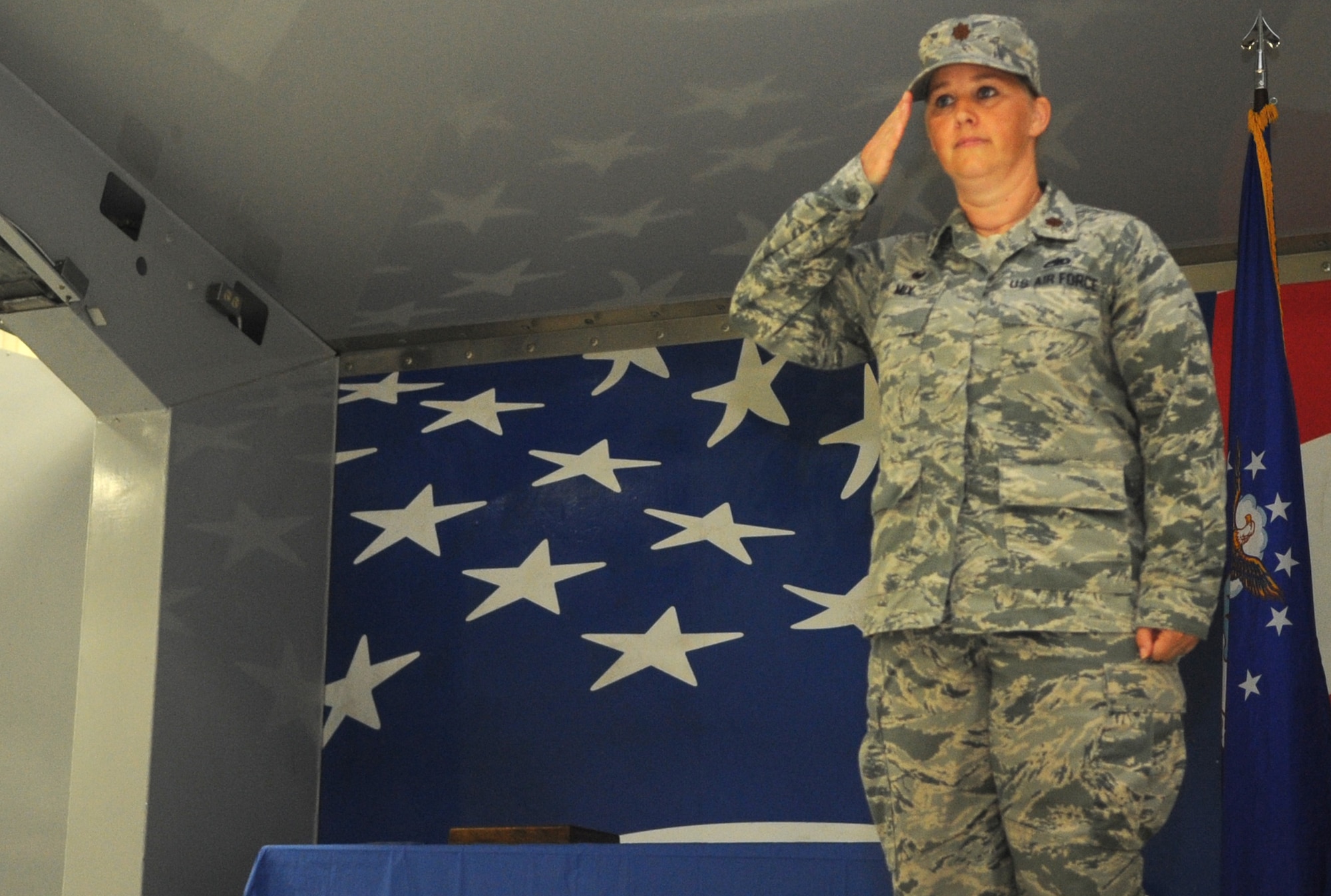 Maj. Kristy Mix, 4th Component Maintenance Squadron incoming commander, returns her squadron’s salute for the first time at the change of command ceremony, June 12, 2015, at Seymour Johnson Air Force Base, North Carolina. A squadron or formation saluting their incoming and outgoing commanders, along with the passing of the guidon, are two of many traditions associated with changes of command. (U.S. Air Force photo/Senior Airman Ashley J. Thum)