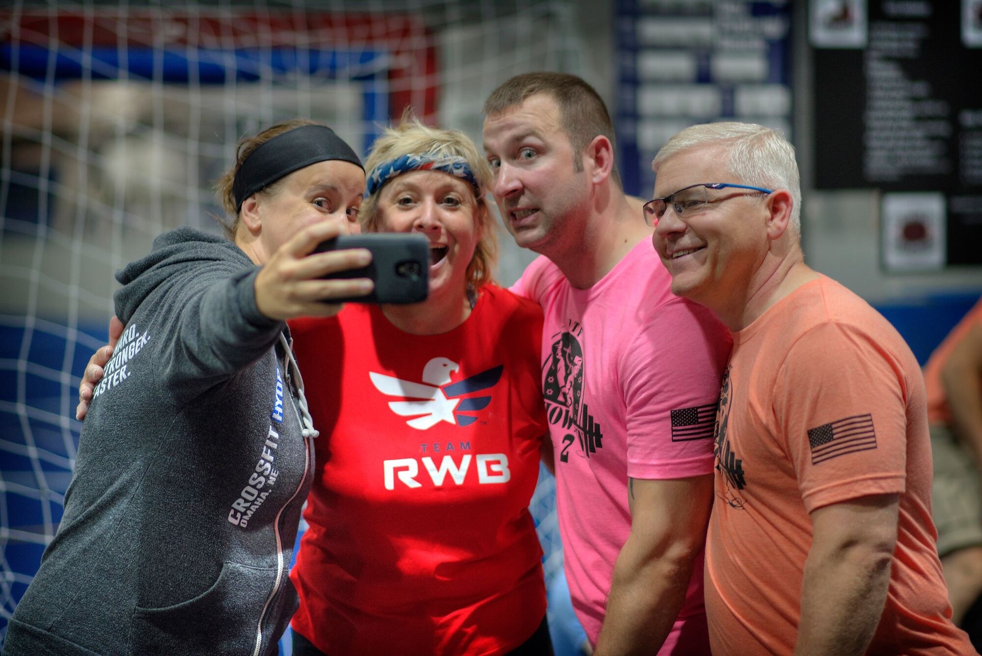 (Left to right) Brianne Kemp of Omaha and Carla Vice, a retired U.S. Navy service member, pose for a photo with U.S. Air Force Master Sgt. John Hendricks and U.S. Air Force Col. David Bacot, who are assigned to the 557th Weather Wing. Kemp and Vice competed in the 3rd annual Team Offutt Tactical Fitness games held June 12 at Offutt Air Force Base, Nebraska. Nearly 50 athletes from Offutt AFB and the greater Omaha area participated in the event that has been held annually at Offutt since 2013. (Courtesy photo)