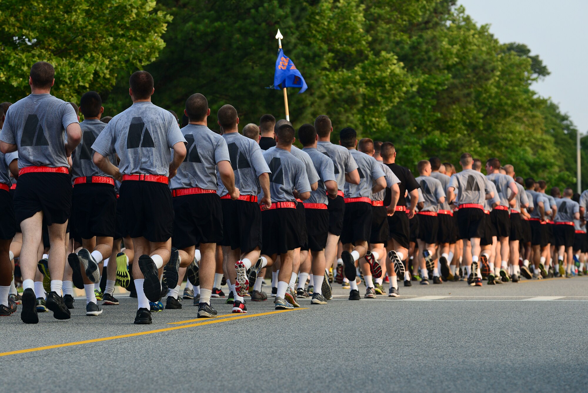 Formations of U.S. Army Soldiers, near the finish line during take part in the Army birthday run at Fort Eustis, Va., June 11, 2015. Throughout the event, Soldiers shouted cadences and encouraging words to fellow Service members to enhance esprit de corps. (U.S. Air Force photo by Senior Airman Kimberly Nagle/Released)  