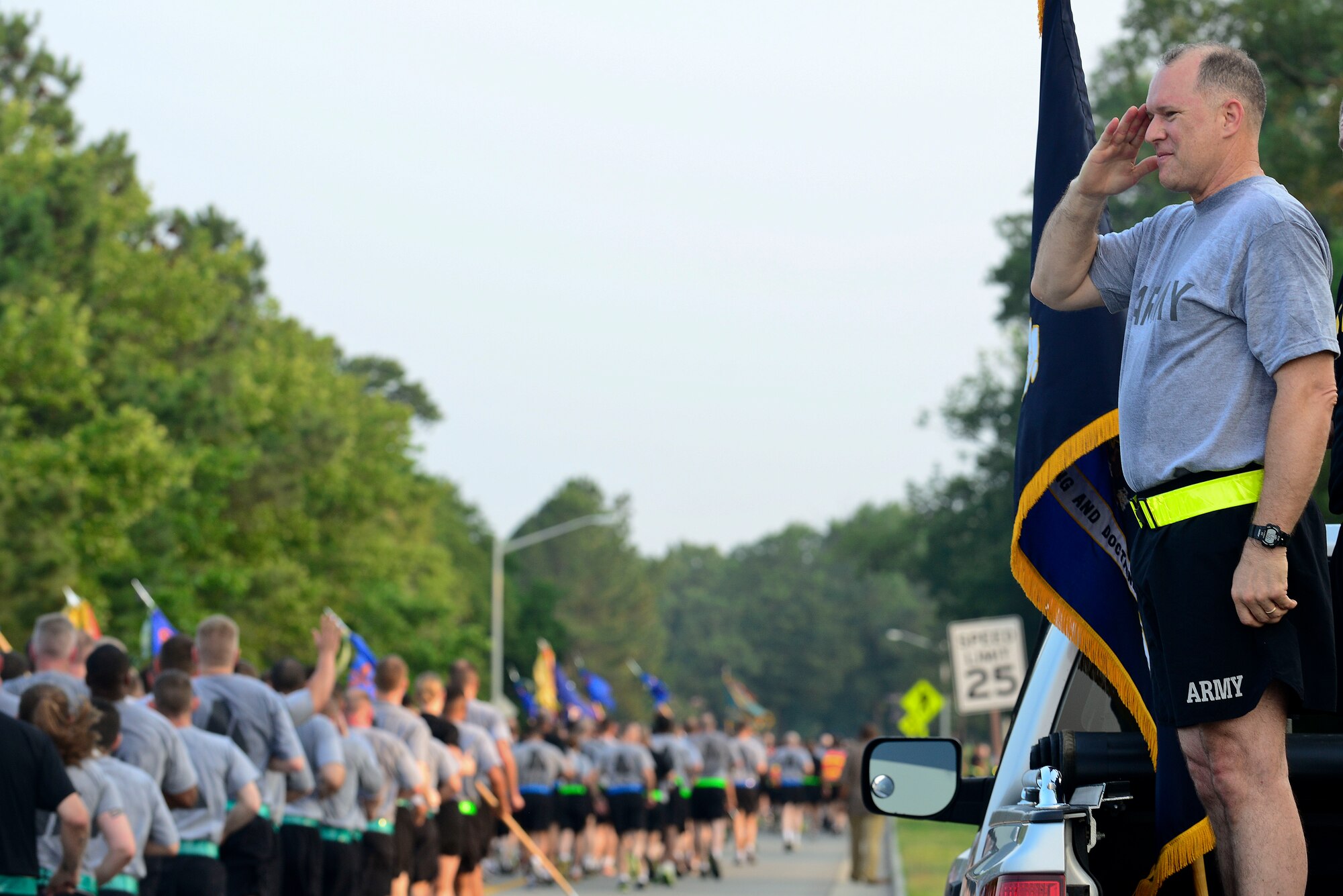 U.S. Army Maj. Gen. Rex Spitler, U.S. Army Training and Doctrine Command deputy chief of staff, renders a salute during the Army birthday run at Fort Eustis, Va., June 11, 2015. Spitler, along with other Fort Eustis leadership, cheered on runners as they finished the 2.2 mile run in honor of the celebration. (U.S. Air Force photo by Senior Airman Kimberly Nagle/Released)  