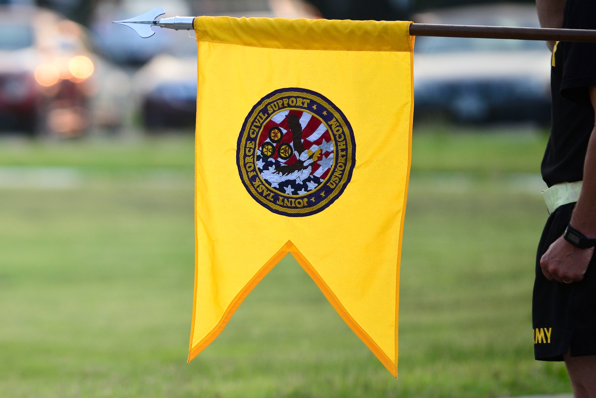 A member of the Joint Task Force-Civil Support holds the unit’s guidon before the U.S. Army birthday run at Fort Eustis, Va., June 11, 2015. During the celebration, each unit ran 2.2 miles in formation to honor the milestone. (U.S. Air Force photo by Senior Airman Kimberly Nagle/Released)  