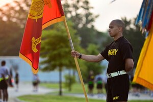 U.S. Army Spc. Mitchell Keeton, 688th Rapid Port Opening Element, 833rd Transportation Battalion, 597th Transportation Brigade, Defense Travel System technician, stands in formation at Fort Eustis, Va., June 11, 2015. Soldiers stood in formation with their units before an installation-wide run celebrating the Army’s 240th birthday.  (U.S. Air Force photo by Senior Airman Kimberly Nagle/Released)  