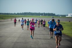 Runners race towards the finish during this year’s “Run the Runway 5k” event June 13, 2015, at Joint Base Charleston S.C.  The annual event, now open to the public, was conducted on a 3.1 mile course certified by USA Track and Field.  (U.S. Air Force photo/Senior Airman Jared Trimarchi)