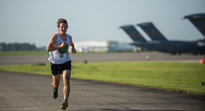 Mark Malandra sprints to the finish during this year’s “Run the Runway 5k” event June 13, 2015, at Joint Base Charleston S.C.  The annual event, now open to the public, was conducted on a 3.1 mile course certified by USA Track and Field.  Malandra was the fastest male with a time of 18:23.  (U.S. Air Force photo/Senior Airman Jared Trimarchi)