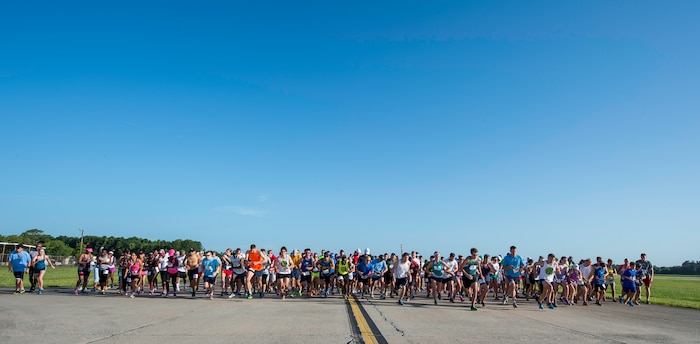 More than 250 runners take-off during this year’s “Run the Runway 5k” event June 13, 2015, at Joint Base Charleston S.C.  The annual event, now open to the public, was conducted on a 3.1 mile course certified by USA Track and Field.  (U.S. Air Force photo/Senior Airman Jared Trimarchi)
