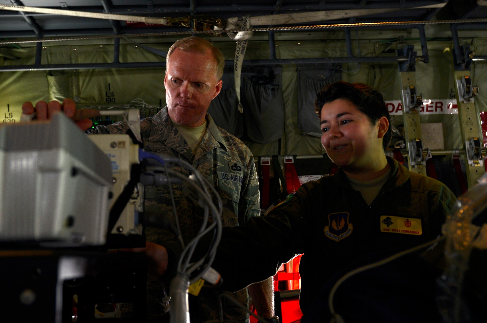 Staff Sgt. Rosy Fernandez, 86th Medical Group respiratory therapist, demonstrates to Chief Master Sergeant of the Air Force James A. Cody how an injured military member receives care during an air rescue operation June 15, 2015, at Ramstein Air Base, Germany. During his visit, Cody held an all-call for Airmen, spoke to senior NCOs and had a tour of Ramstein. (U.S. Air Force photo/Airman 1st Class Tryphena Mayhugh)