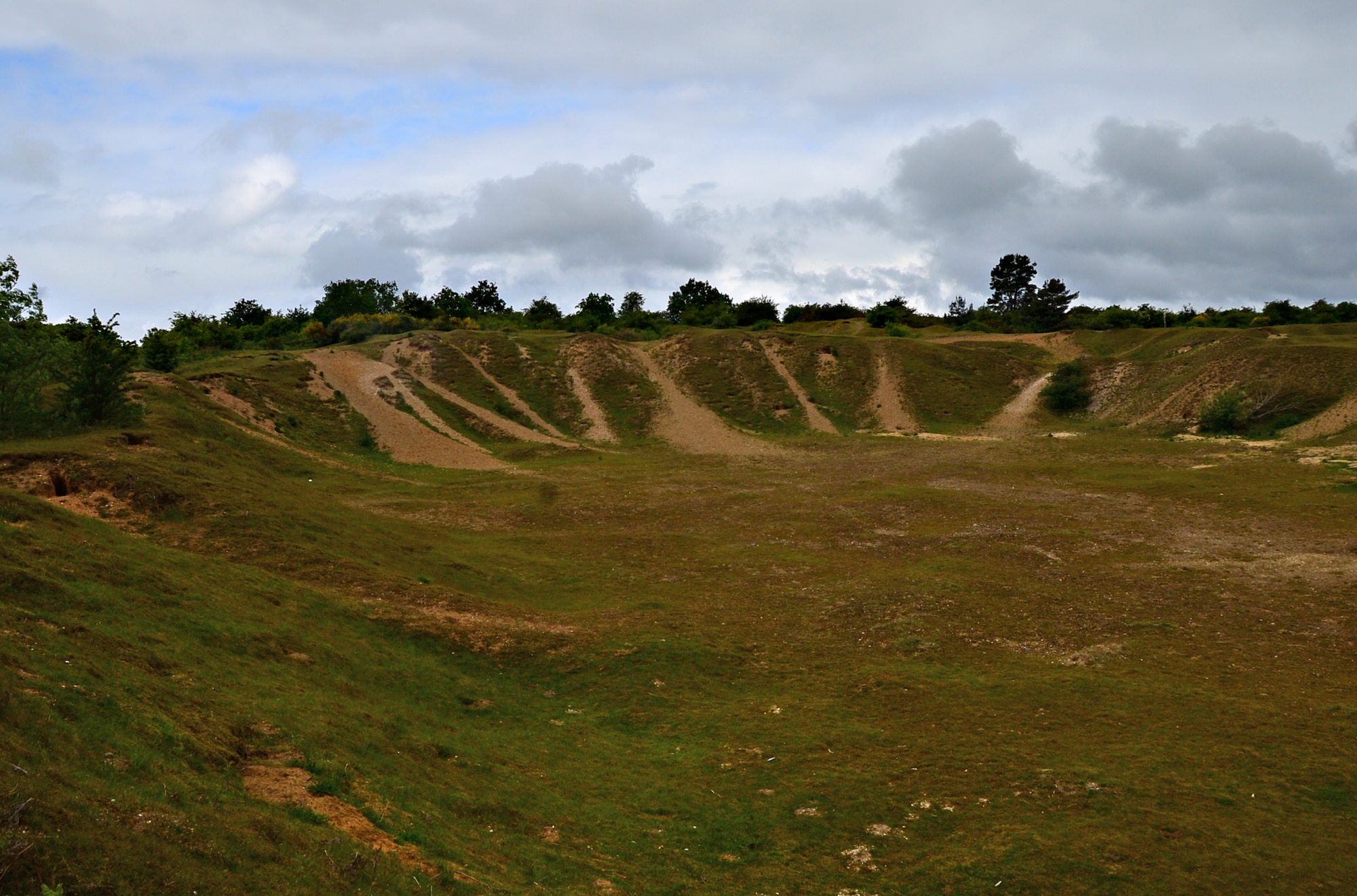 Large pits caused from gravel extraction serve as a unique viewing experience at Maidscross Hill Local Nature Reserve, England, June 9, 2015. The Forest Heath District Council manages the area, which is open to the public to observe the rare plant and animal species residing there. (U.S. Air Force photo by Senior Airman Erin O’Shea/Released)