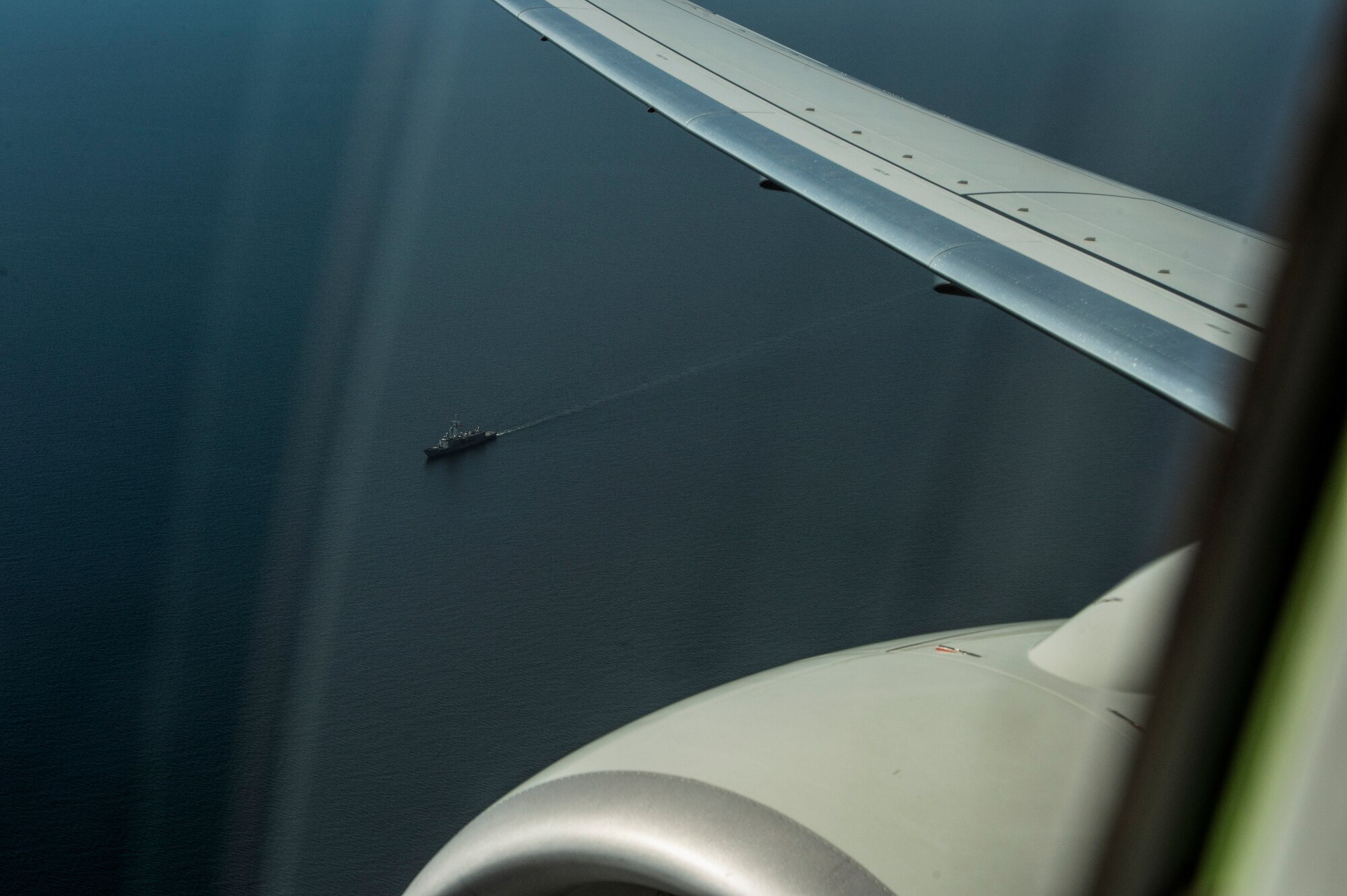 A naval ship is seen outside a Boeing P-8 Poseidon maritime surveillance aircraft during a BALTOPS 2015 mission over the Baltic Sea June 13, 2015. Approximately 5,600 ground, maritime and air personnel from participating nations will demonstrate air defense, maritime interdiction, anti-subsurface warfare and amphibious operations in a joint environment to ensure regional security. (U.S. Air Force photo by Staff Sgt. Christopher Ruano/Released)