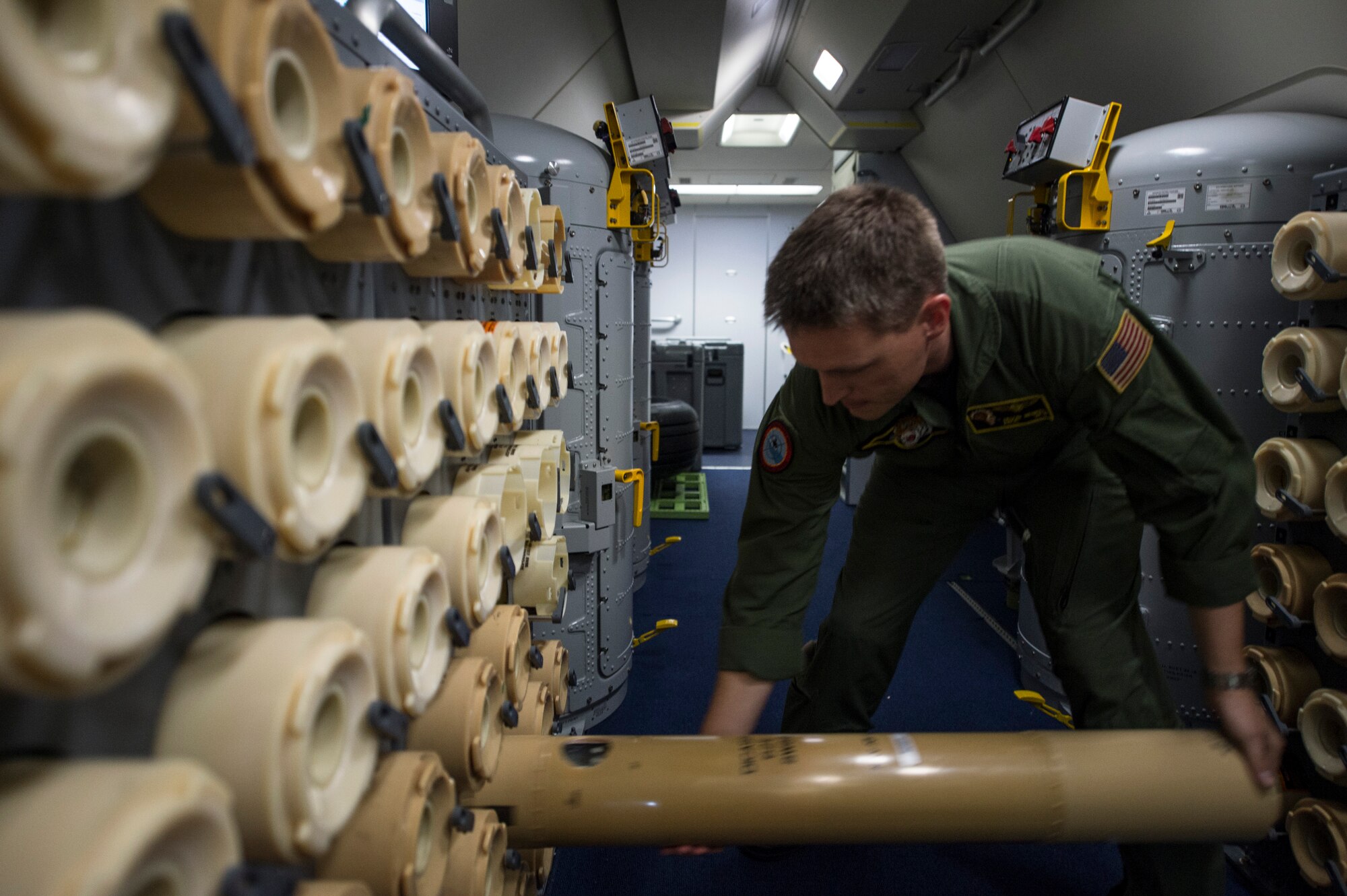 U.S. Navy Chief Petty Officer Jason Heupel, Patrol Squadron Eight electronic warfare operator discards an empty sonobuoy container during a BALTOPS 2015 mission over the Baltic Sea June 13, 2015. Sailors aboard the aircraft use sonobuoys to conduct anti-submarine warfare and underwater acoustic research. Seventeen NATO and partner nations are participating in the 43rd iteration of the multinational maritime exercise BALTOPS 2015 in Poland, Sweden, Germany, and throughout the Baltic Sea. (U.S. Air Force photo by Staff Sgt. Christopher Ruano/Released)