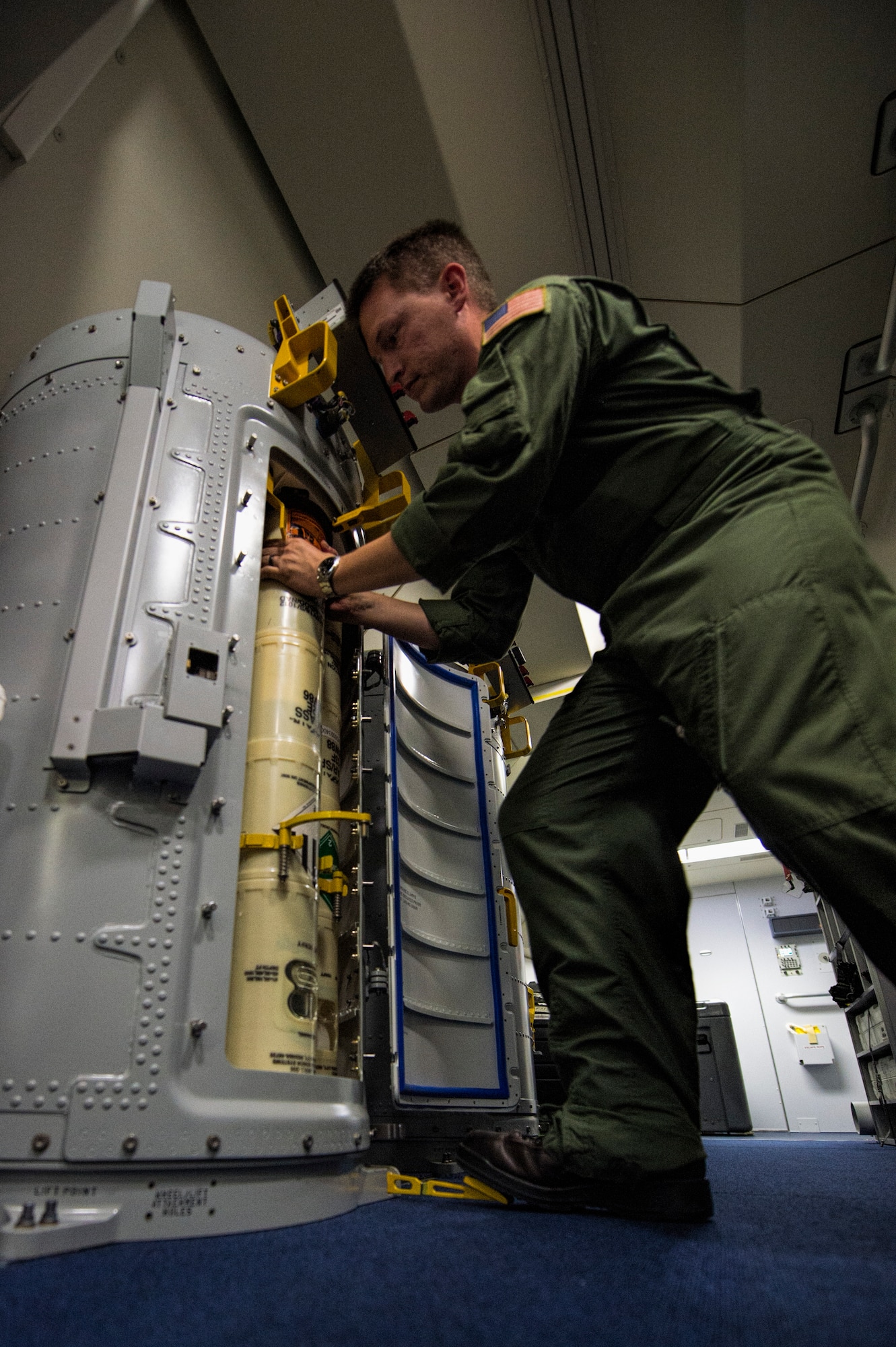 U.S. Navy Chief Petty Officer Jason Heupel, Patrol Squadron Eight electronic warfare operator loads a sonobuoy into a Boeing P-8 Poseidon rotary launcher during a BALTOPS 2015 mission over the Baltic Sea June 13, 2015. The aircraft is equipped with three rotary launchers that hold 10 buoys each and three single launchers. Seventeen NATO and partner nations are participating in the 43rd iteration of the multinational maritime exercise BALTOPS 2015 in Poland, Sweden, Germany, and throughout the Baltic Sea. (U.S. Air Force photo by Staff Sgt. Christopher Ruano/Released)