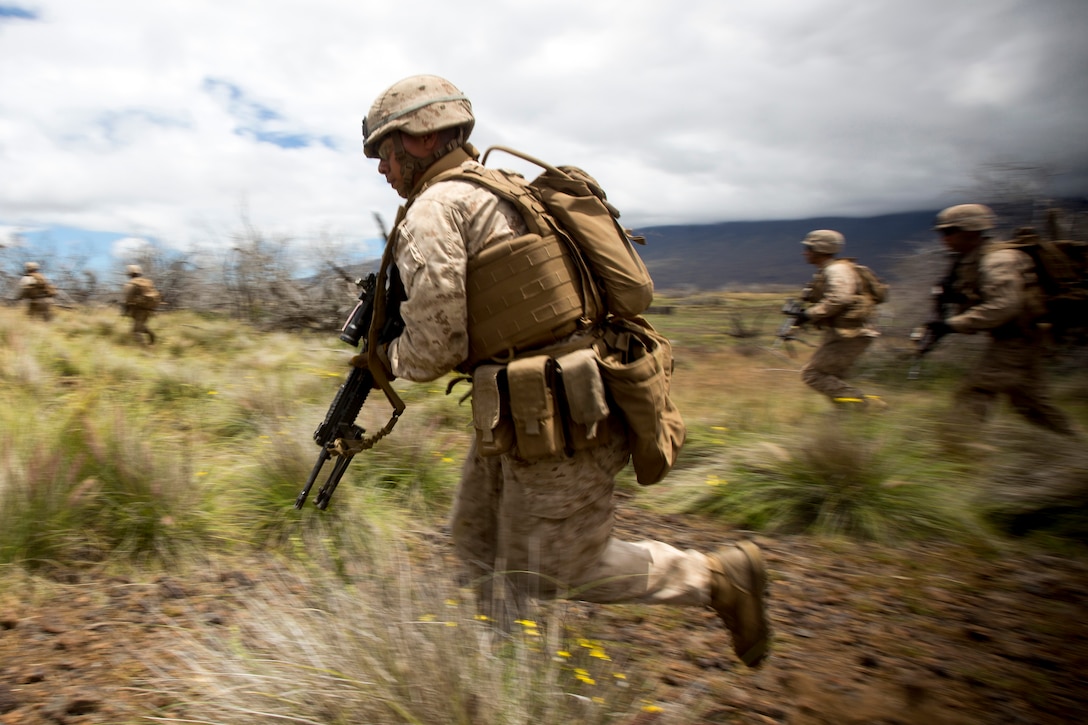 Marines advance toward their next objective during Operation Lava Viper ...