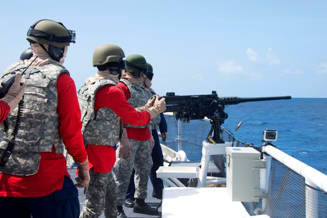 A Dominican sailor fires a .50-caliber machine gun aboard the U.S. Coast Guard Cutter Kathleen Moore during a gunnery event as part of exercise Tradewinds 2015 in the Caribbean Sea, June 4, 2015. Tradewinds is a U.S. Southern Command-sponsored exercise aimed at strengthening the capacity of Caribbean nations to respond to natural disasters, humanitarian crises and transnational organized crime. 