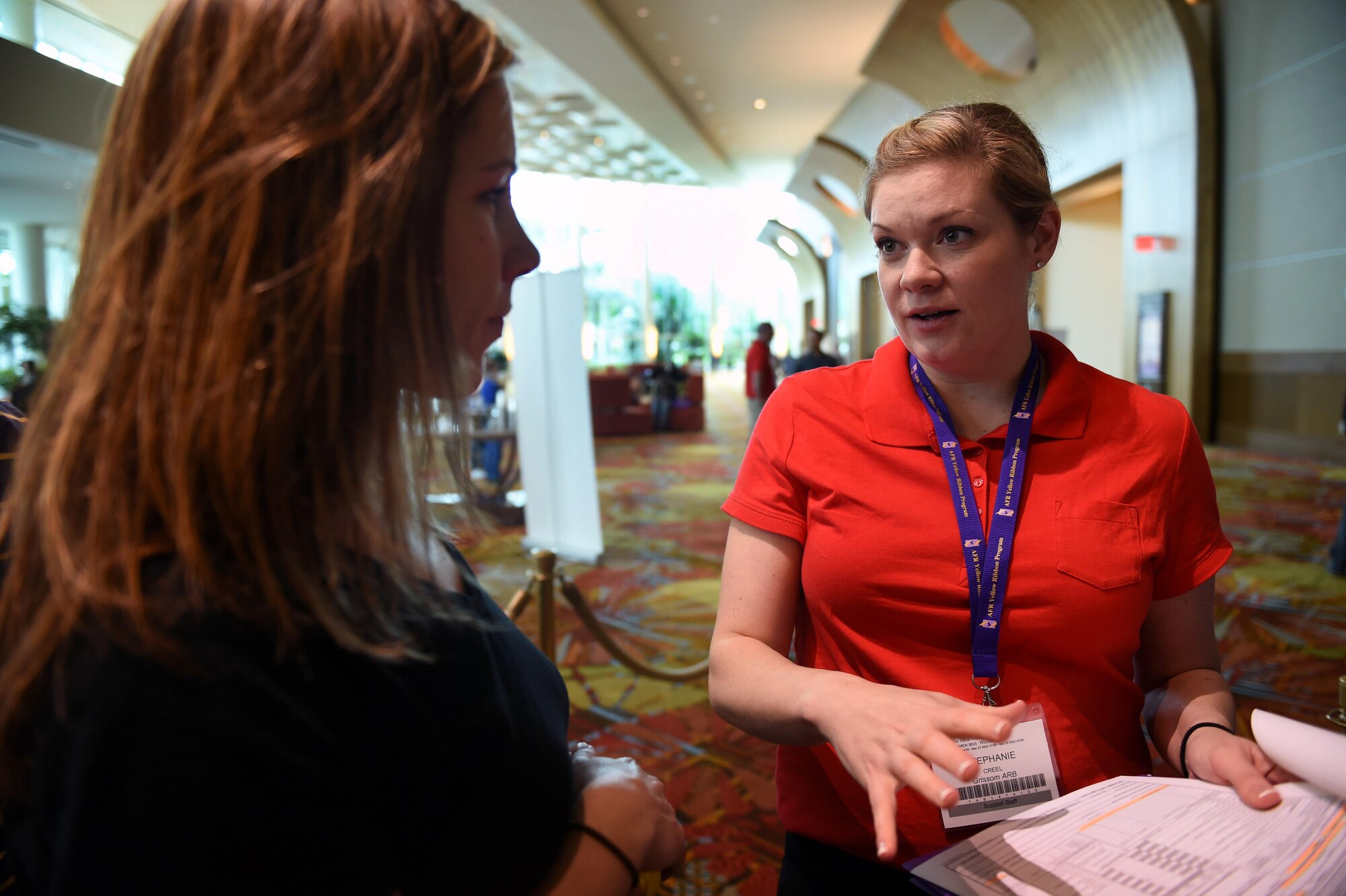 Second Lt. Stephanie Creel, 434th Air Refueling Wing Yellow Ribbon Reintegration Program representative, explains how an Air Force travel voucher is completed to a program attendee during a Yellow Ribbon event in Orlando, Fla., March 28, 2015. The program is a result of a congressional directive in the 2007 Defense Appropriations Act that mandated reserve components provide additional deployment support and reintegration to reservists and their families. (U.S. Air Force photo/Tech. Sgt. Mark Orders-Woempner)