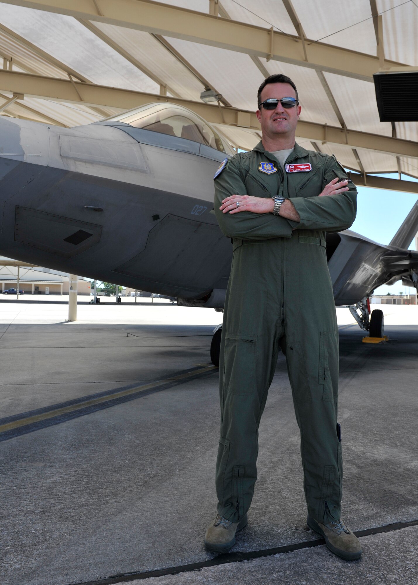 Lt. Col. Randall Cason, 301st Fighter Squadron commander, stands in front of an F-22 Raptor May 18 on the flightline at Tyndall Air Force Base, Fla. In 2006, Cason became the first Air Force Reserve pilot to fly the F-22. (U.S. Air Force photo by Airman 1st Class Sergio A. Gamboa)