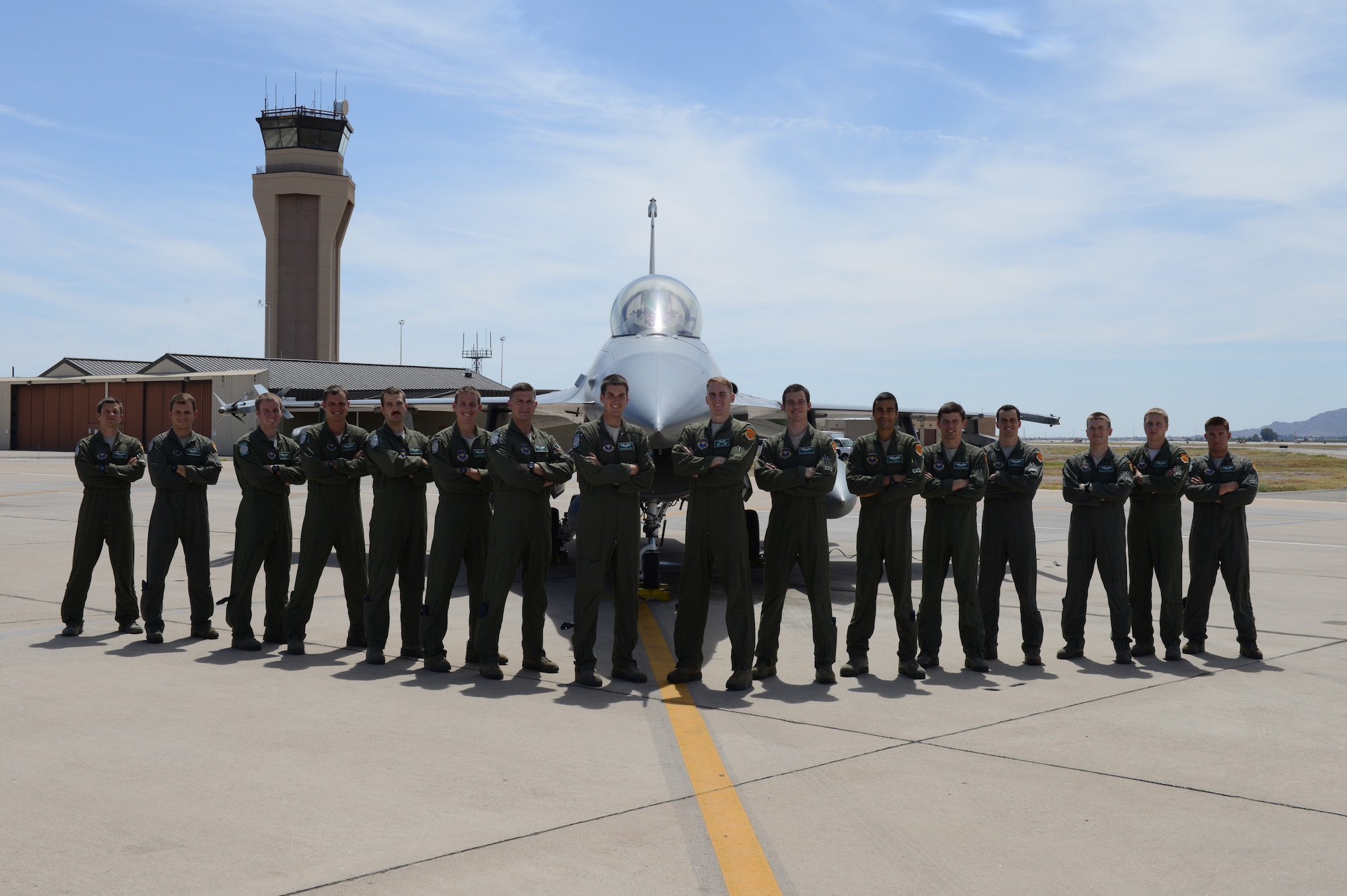 The 308th Fighter Squadron graduated 16 F-16 Fighting Falcon pilots June 12 from Class 14-EBG. It is the last class before standing down. They are, from left, 1st Lt. Tony Demma, Capt. Taylor Roach, 1st Lts. Matt Sanders, Dave Neville and Richard Olsen, Capts. Bryan Koenig and Kent North, 1st Lts. Harrison Gebs and Drew Clasen, Capt. Bradford Waldie, 1st Lts. Ravi Surdhar and Alexander Drummond, Capts. Tanner Lee and James Broncheau, 1st Lt. Ashton Lackey and Capt. Sky Villers. (Courtesy Photo)