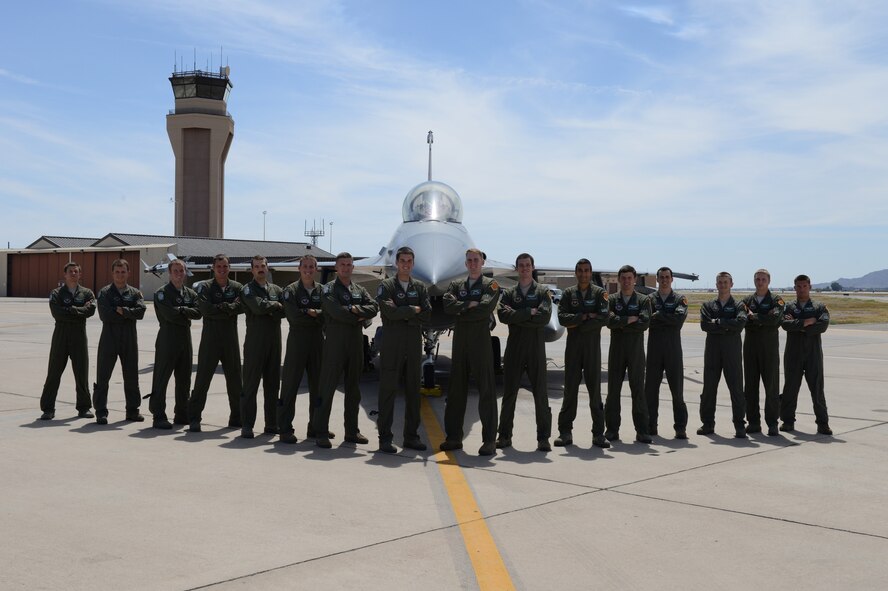 The 308th Fighter Squadron graduated 16 F-16 Fighting Falcon pilots June 12 from Class 14-EBG. It is the last class before standing down. They are, from left, 1st Lt. Tony Demma, Capt. Taylor Roach, 1st Lts. Matt Sanders, Dave Neville and Richard Olsen, Capts. Bryan Koenig and Kent North, 1st Lts. Harrison Gebs and Drew Clasen, Capt. Bradford Waldie, 1st Lts. Ravi Surdhar and Alexander Drummond, Capts. Tanner Lee and James Broncheau, 1st Lt. Ashton Lackey and Capt. Sky Villers. (Courtesy Photo)