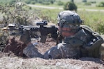 Spc. Nate Meyer, of Fairview, Oklahoma, fires at "enemy" Soldiers during a defensive position training mission at Fort Sill, Oklahoma, June 4, 2015. Meyer is a member of Company B, 1st Battalion, 179th Infantry, 45th Infantry Brigade Combat Team.