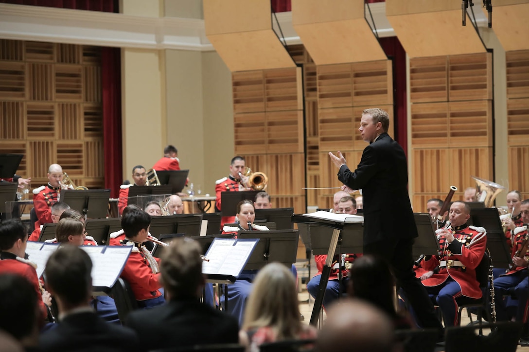 Joseph Higgins conducts the premiere of Ryan Lindveit's Spinning Yarns. "The President's Own" U.S. Marine Band performed as the ensemble in residence for the National Band Association's Young Conductor/Composer Mentor Project which culminated in a concert on Tuesday, June 16 at John Philip Sousa Band Hall featuring three young conductors leading the band in the works of three young composers. (U.S. Marine Corps photo by Staff Sgt. Brian Rust/released) 