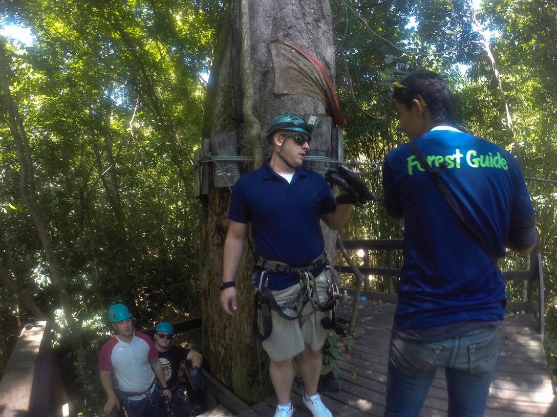 U.S. Marine Sgt. Austin Howard participates in a zip line tour through the jungles of Pattaya Beach, Thailand, June 10, 2015. Howard is the cyber security manager for the 15th Marine Expeditionary Unit. Marines and Sailors aboard the USS Anchorage (LPD 23) enjoyed various leisure activities during a port visit in Thailand. (U.S. Marine Corps photo by Sgt. Jamean Berry/Released)