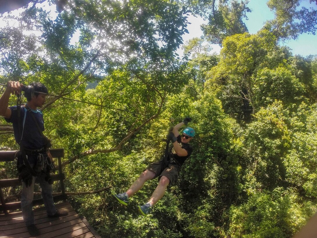 A U.S. Marine with the 15th Marine Expeditionary Unit participates in a zip-line tour through the jungles of Pattaya Beach, Thailand, June 10, 2015.  Marines and Sailors aboard the USS Anchorage (LPD 23) enjoyed various leisure activities during a port visit in Thailand. (U.S. Marine Corps photo by Sgt. Jamean Berry/Released)