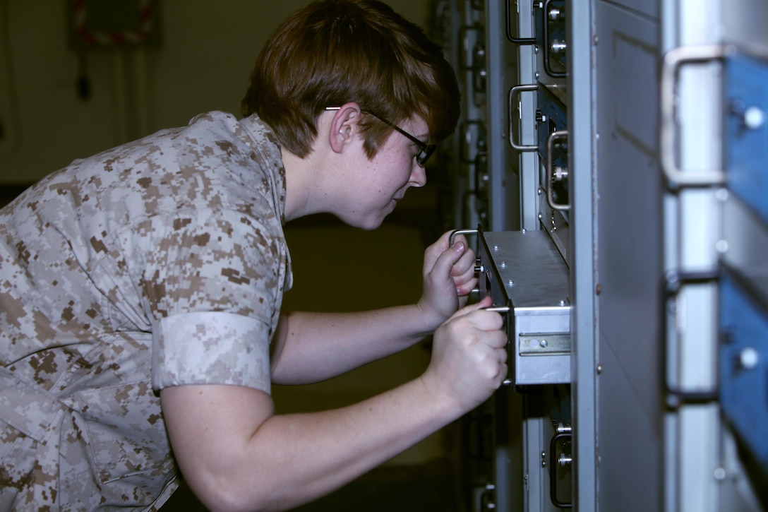 Cpl. Kristen Hirst conducts preventative maintenance on a CM 200 box at Marine Corps Air Station Cherry Point, N.C., June 16, 2015. Air traffic control Marines receive additional training once they arrive on the air station to familiarize themselves with equipment specific to the site. Hirst is an air traffic control communications technician trainee with Head quarters and Headquarters Squadron.