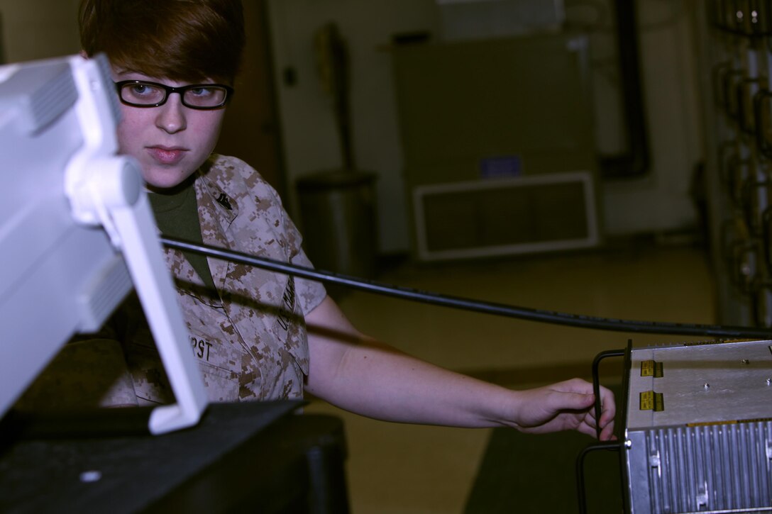 Cpl. Kristen Hirst runs a communication test on a communications service monitor at Marine Corps Air Station Cherry Point, N.C., June 16, 2015. Air traffic control Marines receive additional training once they arrive on the air station to familiarize themselves with equipment specific to the site. Hirst is an air traffic control communications technician trainee with Head quarters and Headquarters Squadron.