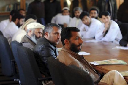 Dr. Mohammed Ghalib, Kunar provincial veterinarian, sits with health professionals at Asadabad Hospital during a rabies prevention and control education session here March 9. Members of the Iowa National Guard's 734th Agribusiness Development Team and Kunar Provincial Reconstruction Team provided the training for the health care professionals.