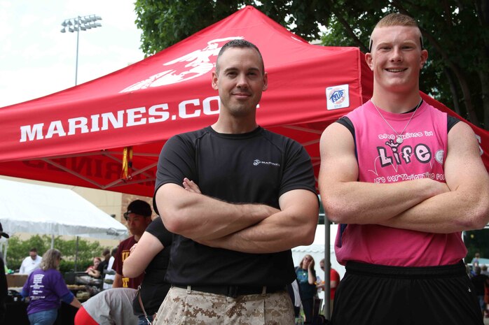 Tyler Morgan stands with his Marine Corps recruiter, Staff Sgt. Benjamin Lindsey, after competing in the Minnesota State High School Track and Field Tournament, June 6. Morgan took first place in shot put, and fifth place in discus. He plans on attending Marine Corps recruit training in early September. 