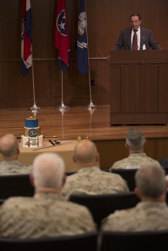 Peter Hebert, an Algiers, Louisiana native and a former Navy hospital corpsman, speaks at the Navy Hospital Corpsman Birthday cake-cutting ceremony at Marine Corps Support Facility New Orleans, June 17, 2015. The Hospital Corps celebrated their 117th birthday this year. Hospital corpsmen started out as "loblolly boys" on warships, assisting the ship's surgeon with medical procedures. Today, corpsmen function as clinical or specialty technicians, medical administrative personnel, health care providers at medical treatment facilities and as battlefield corpsman with the Marine Corps. 