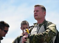 Col. Eric D. Ray, 24th Special Operations Wing vice commander, uses an electronic, hand-held wind meter to check wind speed during a Monster Mash training event, June 11, 2015, at Spectre Island on Eglin Range, Fla. Monster Mash is a long-standing special tactics training tradition, consisting of an obstacle course where special operators complete timed scenarios at different stations of core mission training. Participants were required to coordinate an air-support drop for their mission by providing an aircraft with an accurate release point. (U.S. Air Force photo by Airman 1st Class Ryan Conroy) 