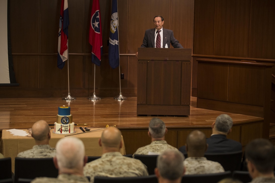 Peter Hebert, an Algiers, Louisiana native and a former Navy hospital corpsman, speaks at the Navy Hospital Corpsman Birthday cake-cutting ceremony at Marine Corps Support Facility New Orleans, June 17, 2015. The Hospital Corps celebrated their 117th birthday this year. Hospital corpsmen started out as "loblolly boys" on warships, assisting the ship's surgeon with medical procedures. Today, corpsmen function as clinical or specialty technicians, medical administrative personnel, health care providers at medical treatment facilities and as battlefield corpsman with the Marine Corps. 