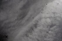 Special Tactics Airmen conduct an amphibious jump from a MC-130 Talon II during a Monster Mash training event, June 11, 2015, at Spectre Island on Eglin Range, Fla. Monster Mash is a long-standing special tactics training tradition, consisting of an obstacle course where special operators complete timed scenarios at different stations of core mission training. (U.S. Air Force photo by Airman 1st Class Ryan Conroy/Released)