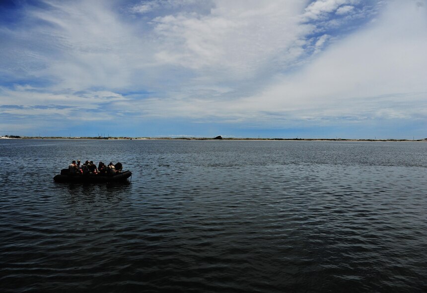Special Tactics Airmen navigate to a simulated hostile territory to conduct a combat search and rescue on downed personnel during a Monster Mash training event, June 11, 2015, at Spectre Island on Eglin Range, Fla. Monster Mash is a long-standing special tactics training tradition, consisting of an obstacle course where special operators complete timed scenarios at different stations of core mission training. (U.S. Air Force photo by Airman 1st Class Ryan Conroy/Released)