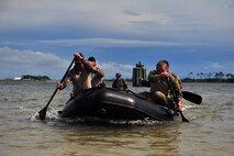 Specials Tactics Airmen navigate approximately one-half mile across the Santa Rosa Sound to extract simulated downed personnel during a Monster Mash training exercise, June 11, 2015, at Spectre Island on Eglin Range, Fla. Monster Mash is a long-standing special tactics training tradition, consisting of an obstacle course where special operators complete timed scenarios at different stations of core mission training. (U.S. Air Force photo by Airman 1st Class Ryan Conroy/Released) 