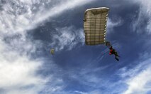 Special Tactics Airmen descend onto Spectre Island during a Monster Mash training event, June 11, 2015, at Eglin Range, Fla. Monster Mash is a long-standing special tactics training tradition, consisting of an obstacle course where special operators complete timed scenarios at different stations of core mission training. The scenario called for Airmen to jump into a simulated hostile territory to conduct a combat search and rescue on downed personnel. (U.S. Air Force photo by Airman 1st Class Ryan Conroy/Released)