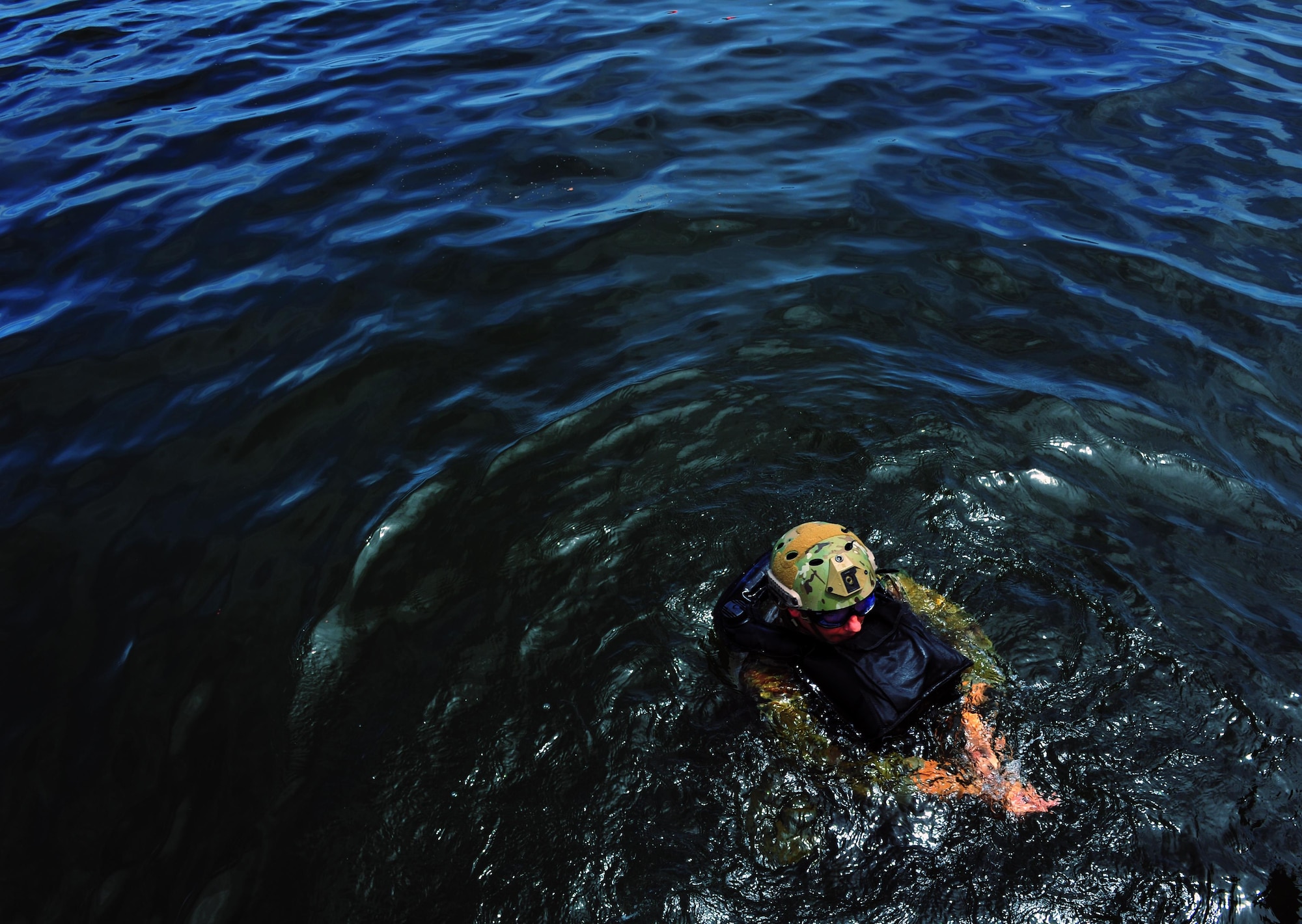 A Special Tactics Airman treads water after an amphibious jump during a Monster Mash training event, June 11, 2015, at Spectre Island on Eglin Range, Fla. Monster Mash is a long-standing special tactics training tradition, consisting of an obstacle course where special operators complete timed scenarios at different stations of core mission training. The scenario called for Airmen to infiltrate a simulated hostile territory to conduct a combat search and rescue on downed personnel. (U.S. Air Force photo by Airman 1st Class Ryan Conroy/Released)