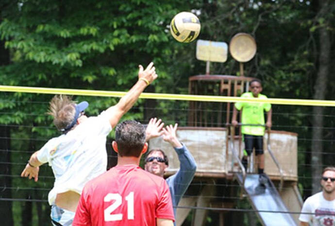 Russ Dunford, Operations chief, U.S. Army Engineering and Support Center, Huntsville, prepares for the spike during a volleyball game at the Huntsville Center's Engineer Day awards ceremony and picnic June 5 at Monte Sano State Park in Huntsville, Alabama.  