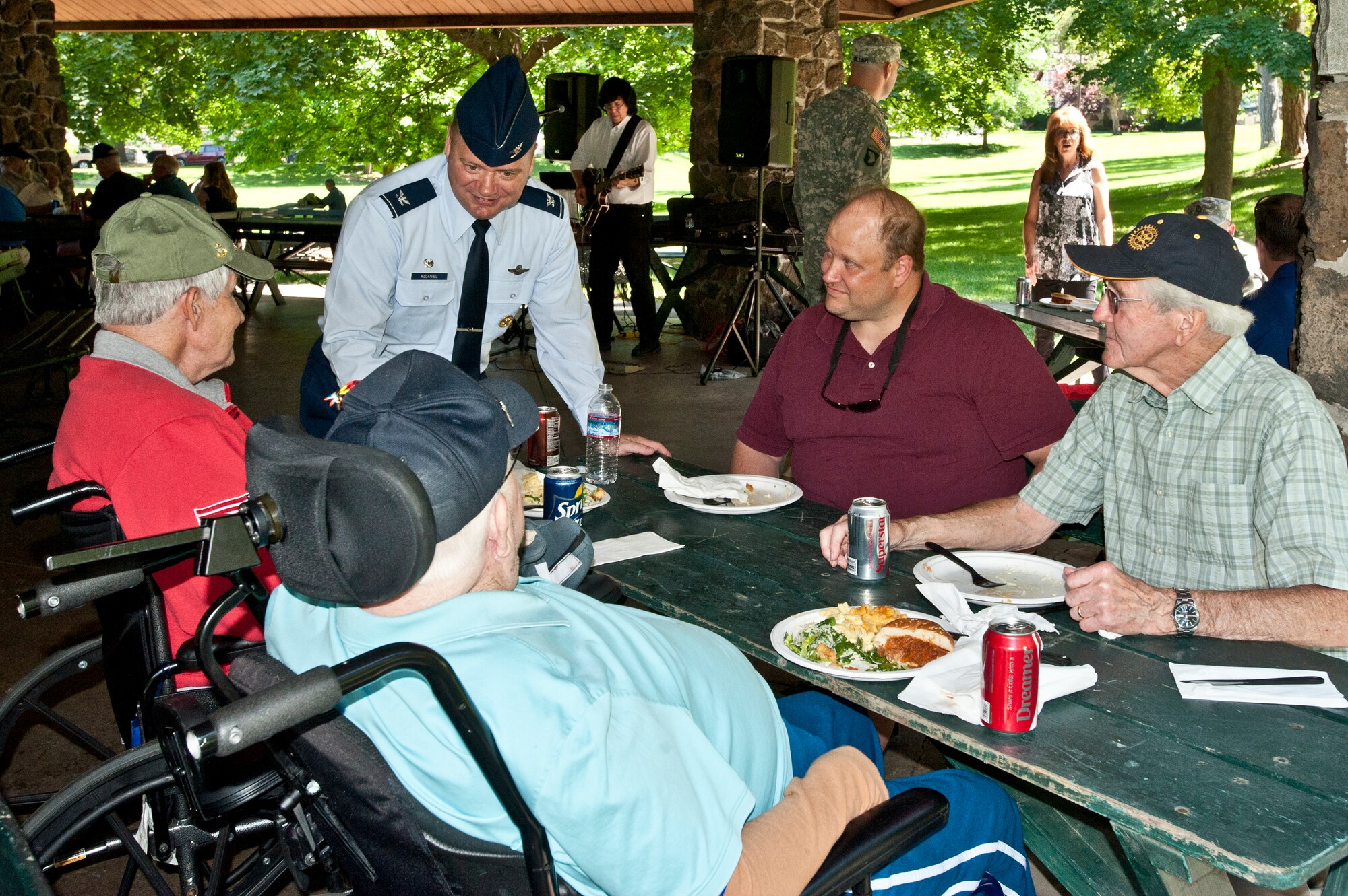 Col. Brian McDaniel, 92nd Air Refueling Wing commander, visits with local veterans during the Rotary Club of Spokane’s veterans’ picnic June 16, 2015, at Manito Park in Spokane, Wash. The veterans enjoyed food, music and visited with local military members from Fairchild Air Force Base during the third annual barbeque led by the Rotary Club of Spokane. (U.S. Air Force photo/Staff Sgt. Veronica Montes)