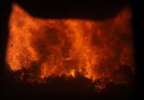 Waste burns in one of the two incinerators at the City of Spokane Waste to Energy plant near Spokane, Wash., June 16, 2015. Garbage and other forms of refuse, some of which come from Fairchild Air Force Base, is disintegrated at more than 2,000 degrees Fahrenheit at the plant to generate power for the Spokane area and elsewhere. (U.S. Air Force photo/Senior Airman Sam Fogleman)