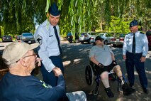 Col. Brian McDaniel, 92nd Air Refueling Wing commander, and Chief Master Sgt. James Fitch, 92nd Operations Group chief, meet local veterans during the Rotary Club of Spokane’s veterans’ picnic June 16, 2015, at Manito Park in Spokane, Wash.  This was the third annual barbeque held by the Rotary Club of Spokane, which honored veterans from the Spokane Veterans Home.  (U.S. Air Force photo/Staff Sgt. Veronica Montes)