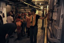 Kris Major, City of Spokane Solid Waste Disposal education coordinator, shows the Waste to Energy plant’s incinerator to a visiting school group near Spokane, Wash., June 16, 2015. Waste, including garbage from Fairchild Air Force Base, is burned off to generate steam for electrical generators which help to power the community. (U.S. Air Force photo/Senior Airman Sam Fogleman)