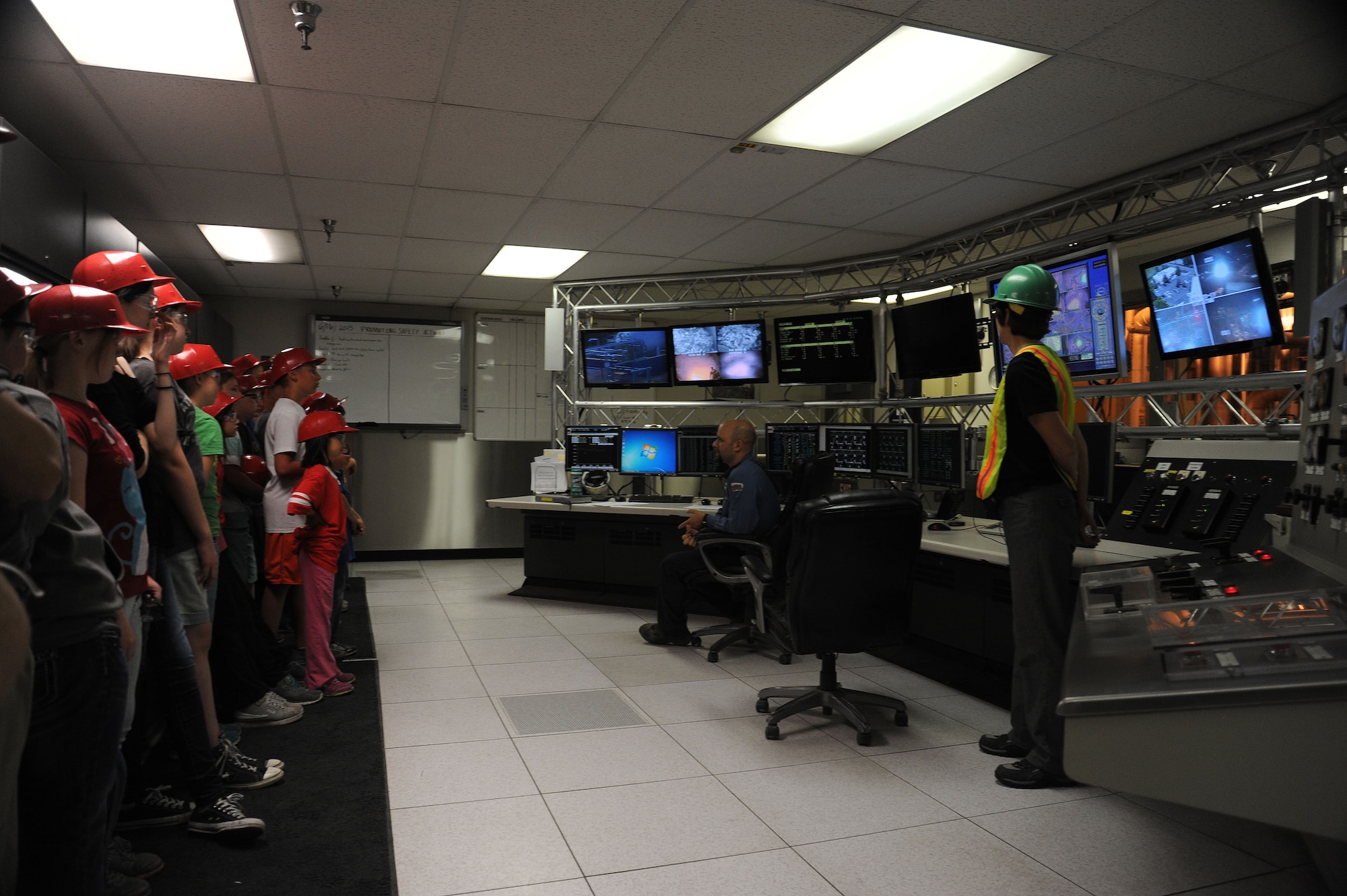 Employees of the City of Spokane’s Waste to Energy plant discuss the inner workings of the facility’s control room with school students near Spokane, Wash., June 16, 2015. The non-profit facility generates enough power for 13,000 homes each day, using the revenue from the sale of electricity and dumping fees to fund its operations. (U.S. Air Force photo/Senior Airman Sam Fogleman)