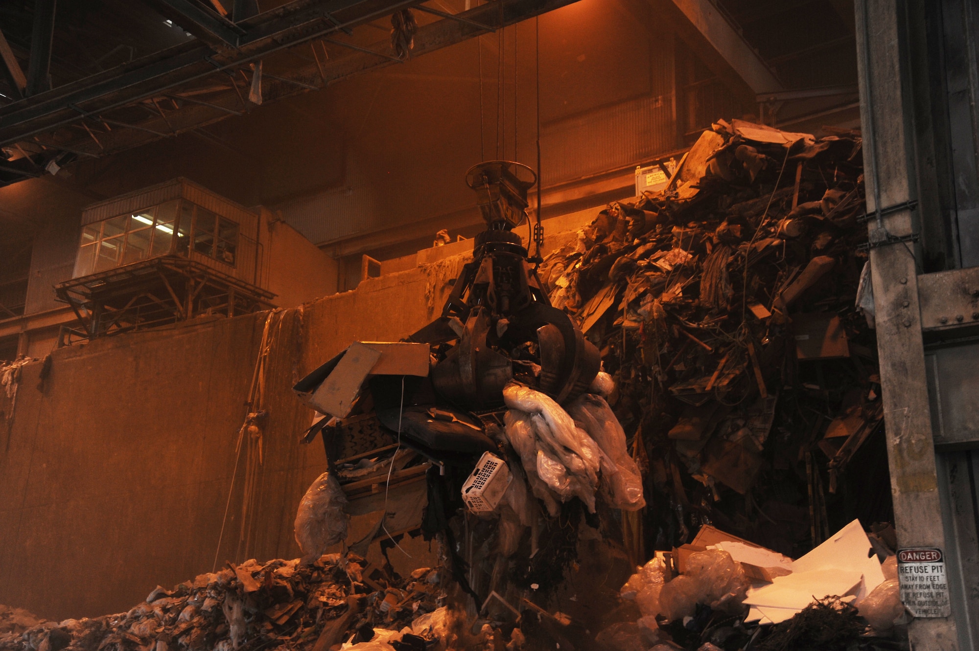 The trash collection claw scoops up a load of refuse at the Waste to Energy plant near Spokane, Wash., June 16, 2015.Waste from Fairchild Air Force Base contributes to the 800 tons of trash the facility burns a day, resulting in enough electrical energy to power 13,000 homes. (U.S. Air Force photo/Senior Airman Sam Fogleman)