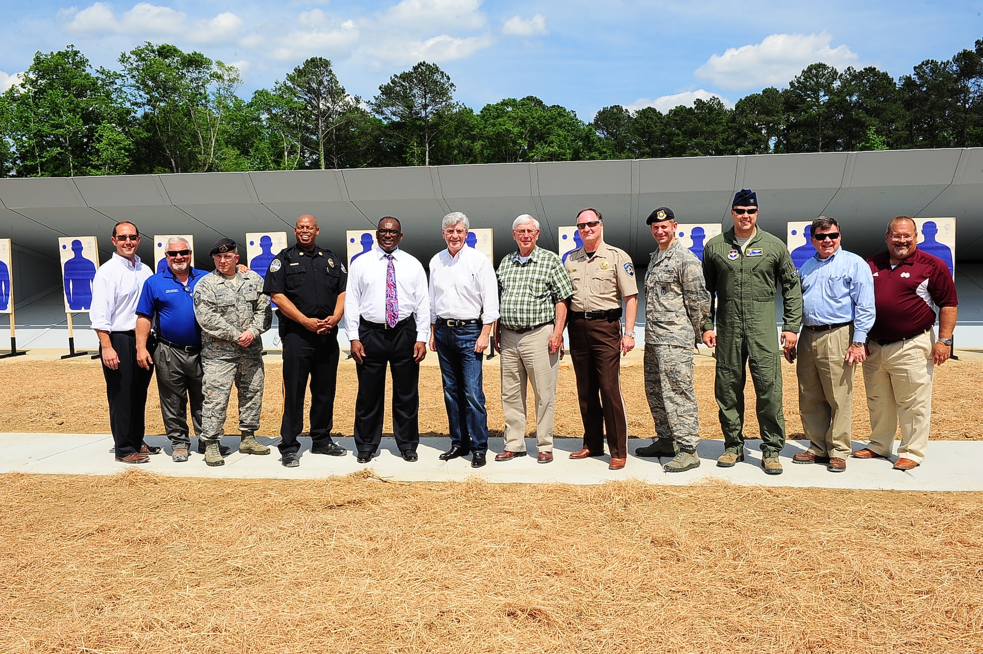 Distinguished shooters including Columbus Air Force Base, Mississippi, members, Mississippi Governor Phil Bryant and other local community members officially open the Columbus Lowndes County Small Arms Range May 8 in Lowndes County, Mississippi. The new range is a 26-minute drive from Columbus AFB in East Columbus, just off Mississippi Highway 69. (U.S. Air Force photo/Airman Daniel Lile)