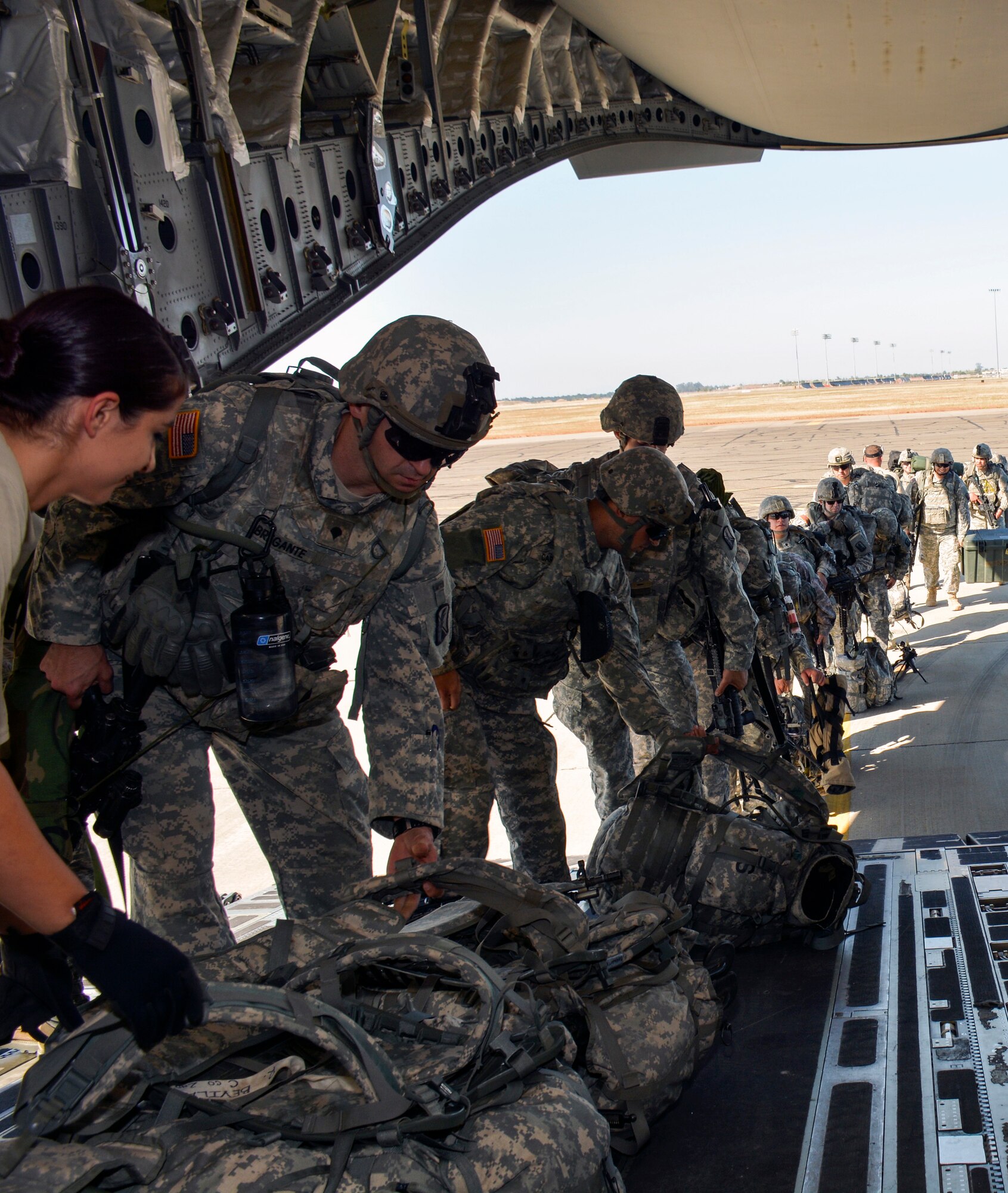 TRAVIS AIR FORCE BASE, Calif. -- The 301st Airlift Squadron provided airlift in a C-17 Globemaster III June 6, 2015 for more than 70 California Army Guardsmen, four humvees and one truck from Mather Air Force Base, Calif. to Ft. Hunter Liggett, Calif. as part of an earthquake exercise during Air Force Specialty Code training.The overall exercise provided a seamless integrated training experience for Air Force Reservists, active duty and Army National Guard service members. (U.S. Air Force photo/Senior Airman Madelyn Brown)