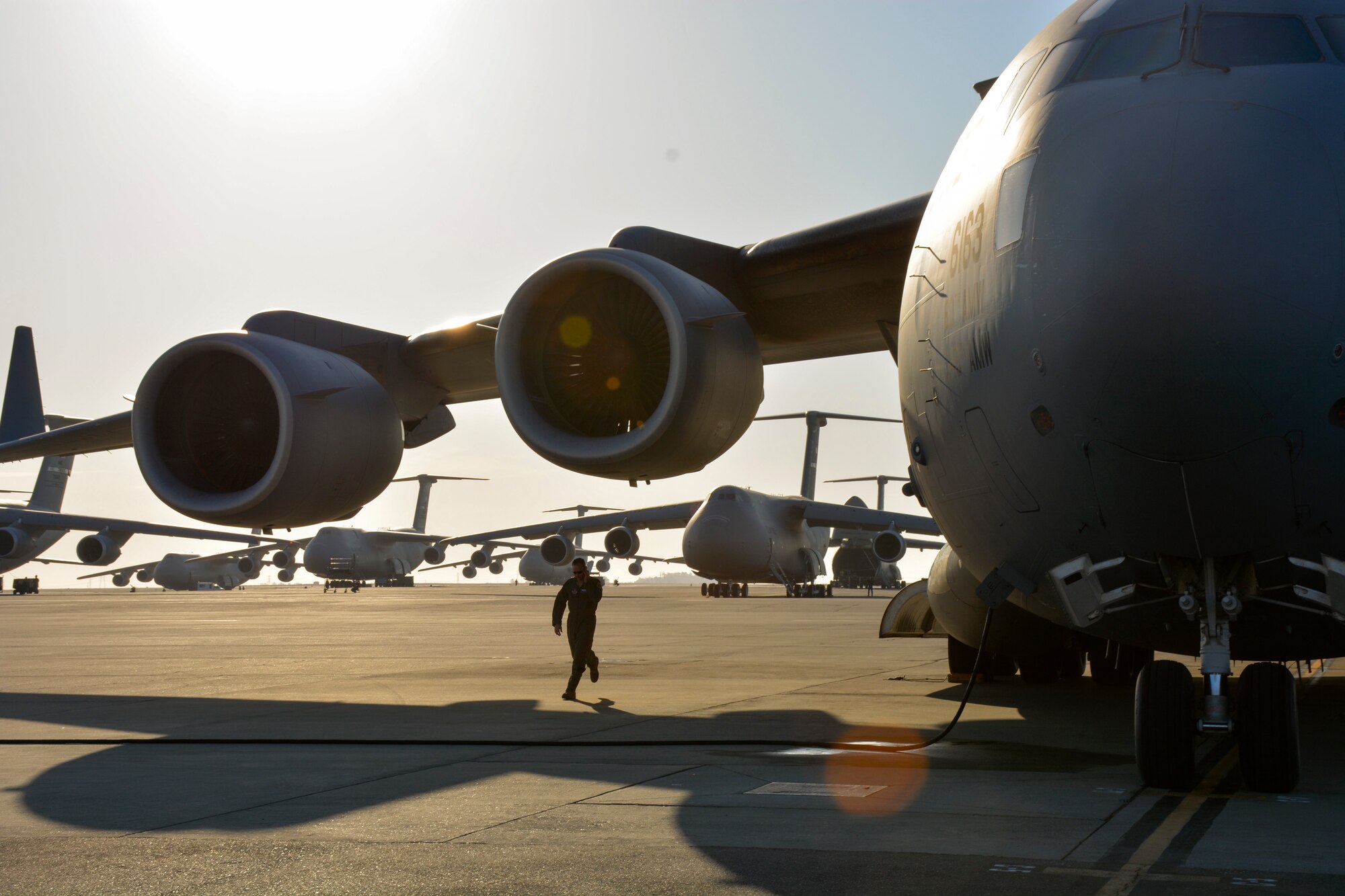 TRAVIS AIR FORCE BASE, Calif. -- The 301st Airlift Squadron provided airlift in a C-17 Globemaster III June 6, 2015 for more than 70 California Army Guardsmen, four humvees and one truck from Mather Air Force Base, Calif. to Fort Hunter Liggett, Calif. as part of an earthquake exercise during Air Force Specialty Code Training. (U.S. Air Force photo/Senior Airman Madelyn Brown)